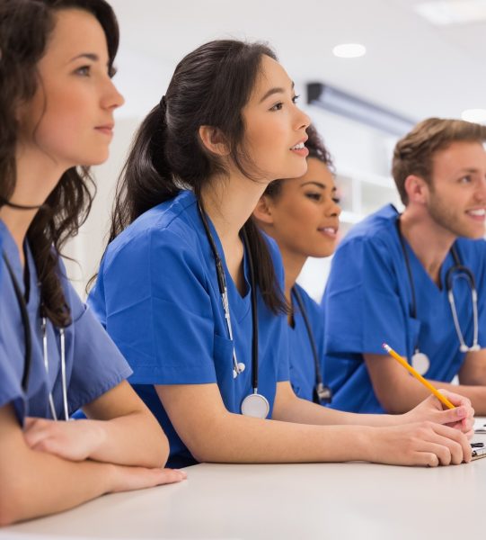 Medical students listening sitting at desk at the university
